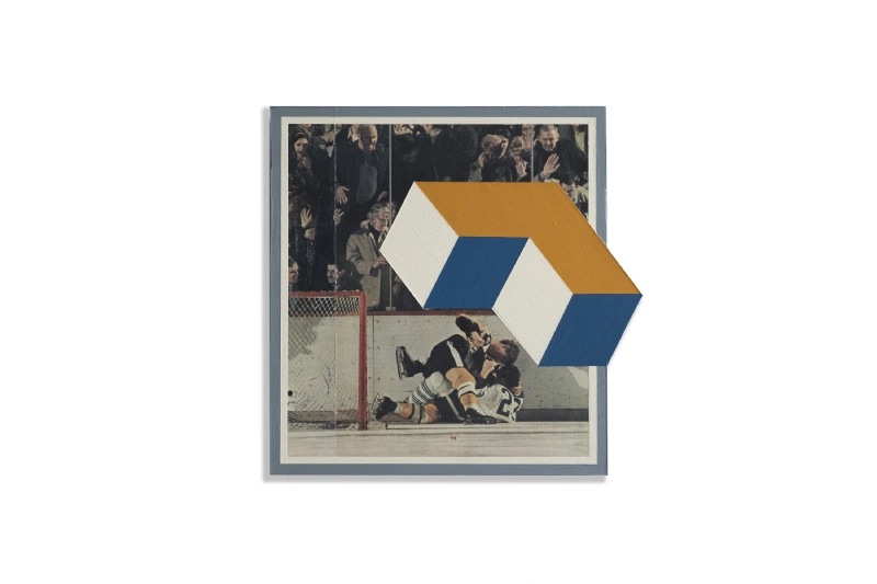 Framed photo-collage artwork partly covered by a projecting blue, ochre, and white geometric form.