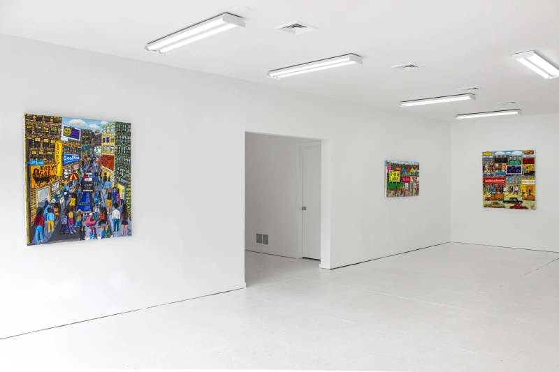 Three colorful city-scene paintings displayed across a bright white gallery.